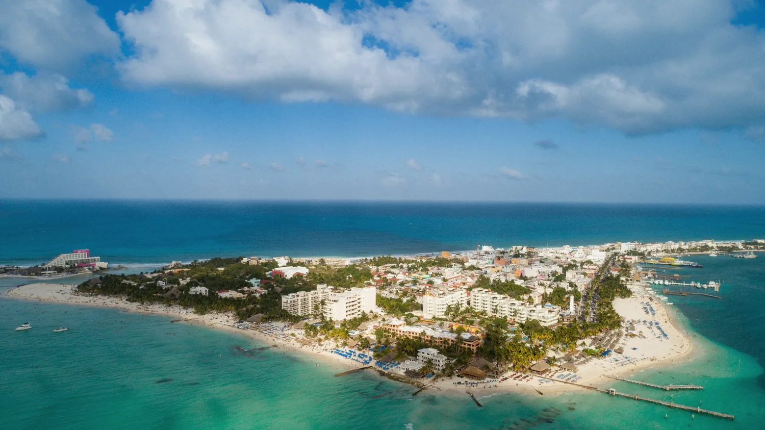 Turquoise coastline of Isla Mujeres seen from above on a snorkeling day trip from Cancun