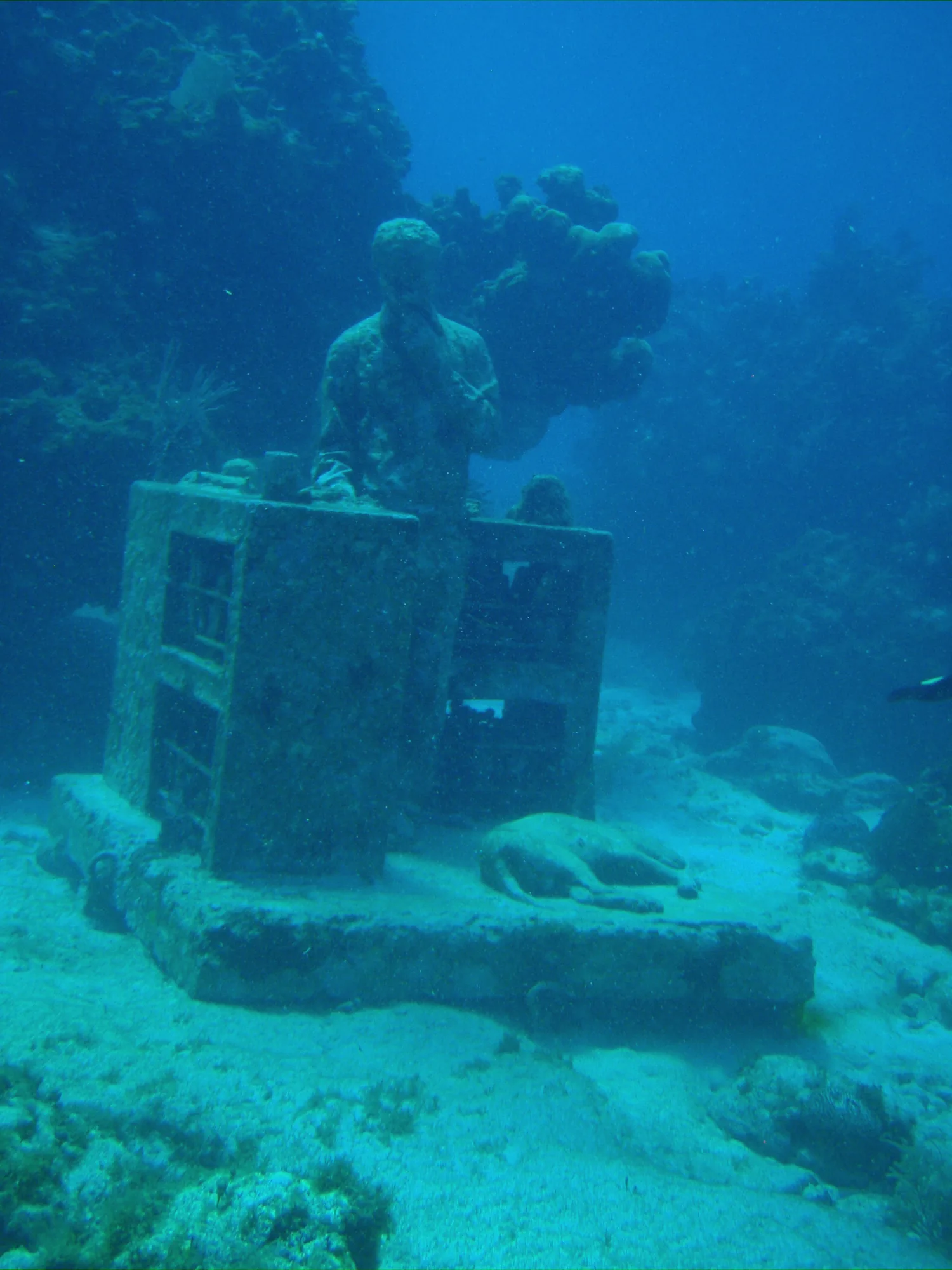 Submerged sculpture called The Dream Collector on Manchones reef at the MUSA underwater museum, Cancun, Mexico