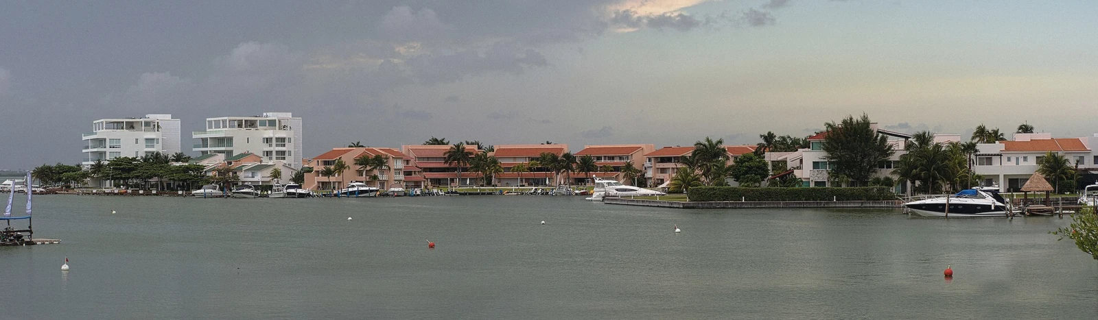 Panorama of Laguna Nichupte with calm green water and mangrove shoreline in Cancun, Mexico